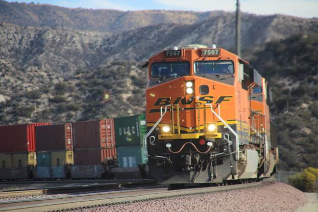 BN-SF 7567, a GE ES44DC; BN-SF 7908, a GE ES44DC; and BN-SF 5711, a GE AC4400CW, are heading west with a stack train on Track #2.